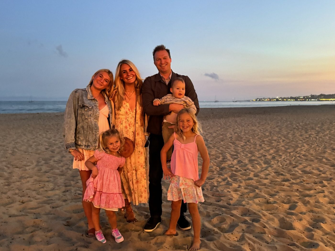 Caleb Overton with his wife Ashley and their four children on the beach in Santa Barbara at sunset